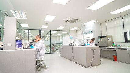 Laboratory technicians conducting research in a modern lab environment during daytime