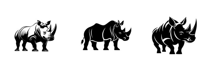 Fototapeta premium Vector illustration of minimalist black-and-white rhinoceros silhouettes showcasing their unique forms and features
