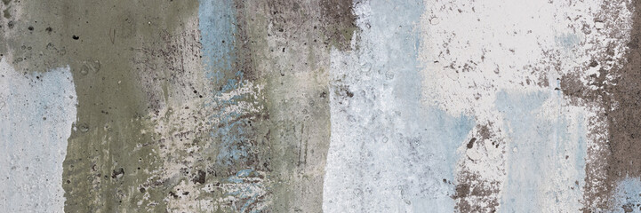 Vintage wall texture. The weathered, rough surface of a plastered concrete wall with faded paint. Wide panoramic texture for background and design.