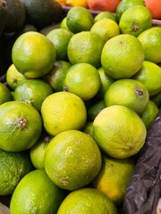 A close-up of fresh green limes