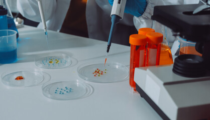 Collaboration, tablet or science with people in lab together for research or development. Innovation, tech and microscope with scientist team in clinical trial for planning or medical investigation