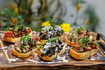 Delicious Assorted Bruschetta on Wooden Board with Fresh Toppings