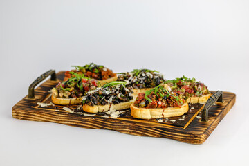 Delicious Assorted Bruschetta on Wooden Board with Fresh Toppings