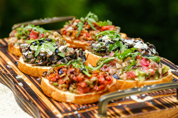 Delicious Assorted Bruschetta on Wooden Board with Fresh Toppings