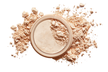 A light beige, powdered cosmetic product, a circular compact, surrounded by scattered powder.  The compact is partially filled with the same powder