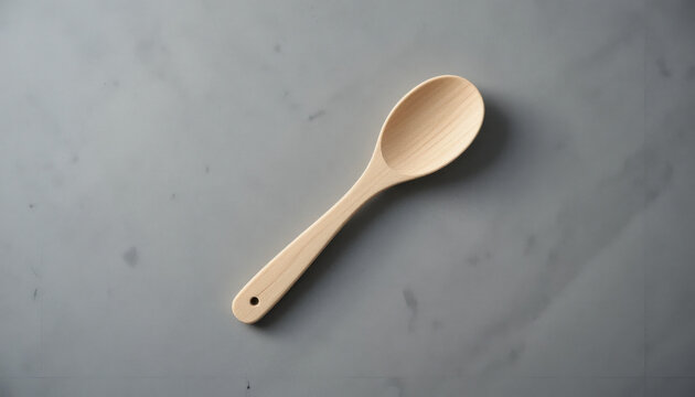 Simple wooden spoon on a textured gray background - Powered by Adobe