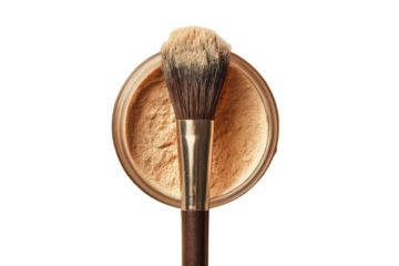 Light tan pressed powder in a jar with a makeup brush
