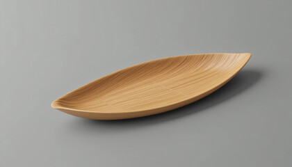 Elegant wooden leaf shaped serving dish on a neutral background