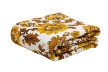 Folded blanket featuring a repeating pattern of gold-toned sunflowers and leaves on a white background