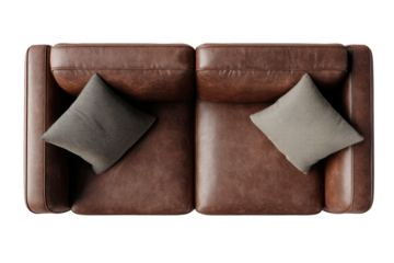 Top-down view of a brown leather couch with linen pillows