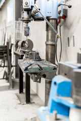 Precision Drilling Machine Used in a Typical Workshop Setting for Various Tasks and Projects