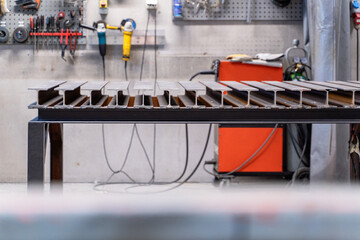 An Industrial Workshop Featuring a Strong Steel Framework Alongside Various Tools and Equipment