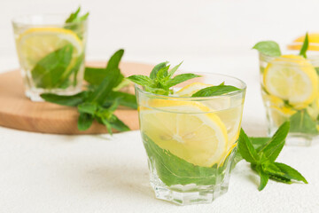 Mojito cocktail. Refreshing mojito cocktail with lime, lemon and mint in a tall glass with a stick