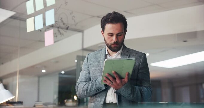 Businessman, typing and schedule planning with tablet on glass board for agenda or night project. Man, employee or planner with technology, ideas or sticky notes for mindmap or brainstorming work