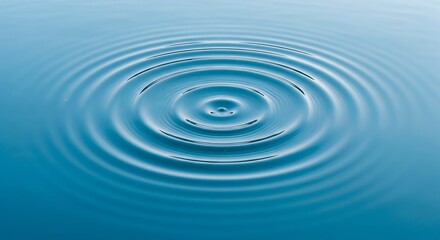 Concentric Ripple Water An abstract concentric ripple in calm blue water from an overhead view creating a serene pattern