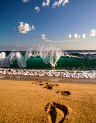 Ocean waves crashing on sandy beach