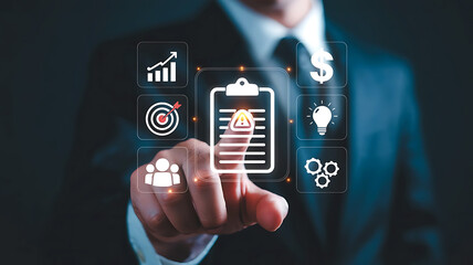 Businessman touching a digital clipboard with icons representing business strategy and growth on a dark background