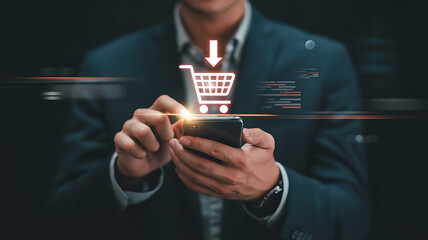Man in suit using smartphone with glowing shopping cart icon and download arrow representing online shopping and e commerce