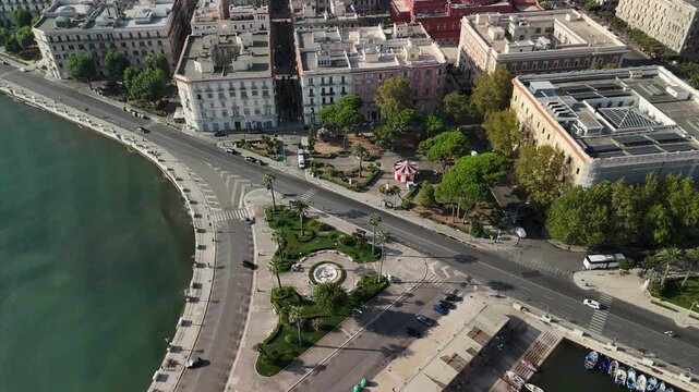 Aerial Drone View of Waterfront Promenade, Public Park with Carousel, and Historic Architecture in Bari, Apulia, Southern Italy, Overlooking the Adriatic Sea and Marina