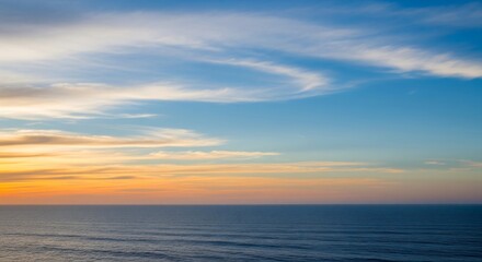 Fototapeta premium Horizon Sea Sky A horizon line of sea and sky with a soft cloud gradient creating a peaceful and expansive view