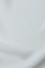 Obraz premium Soft folds. White silk fabric. Luxury background with space for design, top view