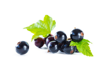 Ripe blackcurrant berries with leaves isolated on white.