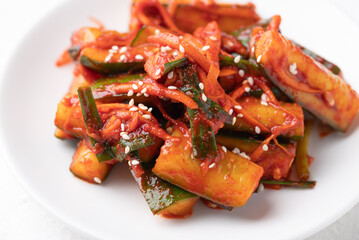 Korean kimchi cucumber on white plate, Korean side dish, Homemade food
