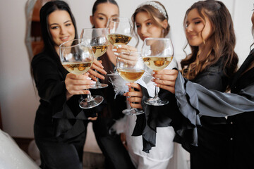 Friends celebrating with champagne glasses in a cozy indoor setting during a festive gathering