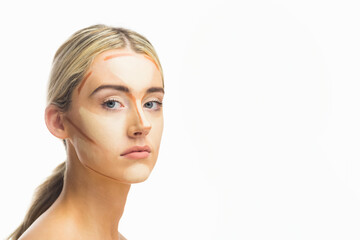 Obraz premium Posing woman wearing contour cream stripes in professional studio, with white backdrop