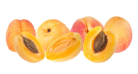 ripe apricots and apricot halves showing the pit
