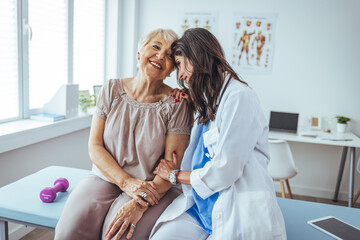 Doctor Consoling Elderly Patient During a Caring Medical Appointment in Bright Office