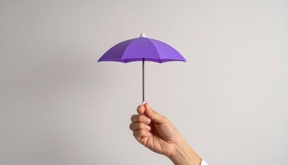 A hand holding a small purple umbrella