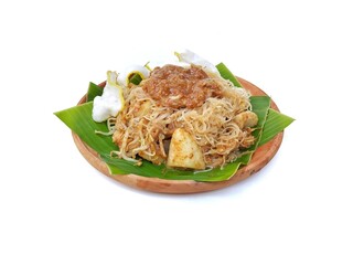Ketoprak or Indonesian traditional food made from mix vegetables, tofu and peanut sauce on wooden table background. High angle view 