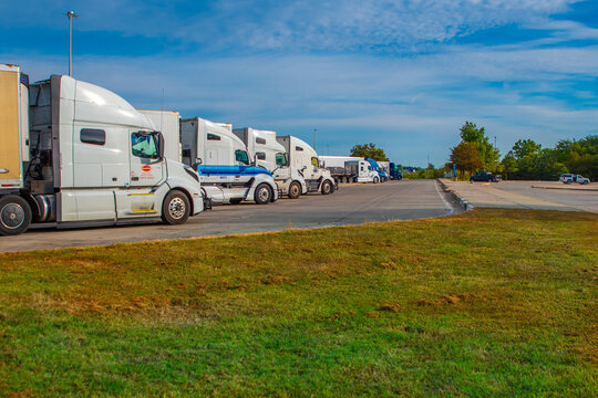 Greenville, IL&mdash;Sept 9, 2025; row of cargo semi-trucks parked at rest area in southern Illinois 