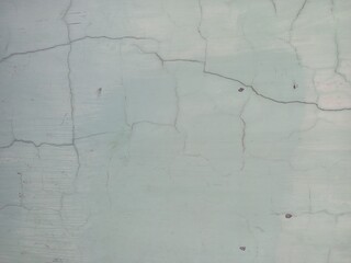 Pale Green Concrete Wall with Cracks