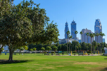 Green park in the center of Dubai with a view of the skyscrapers of Downtown Dubai. A great place to take a break from work