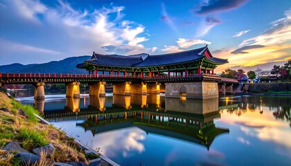 Naklejka premium A serene, colorful bridge over tranquil waters, reflecting a vibrant sky at dusk.