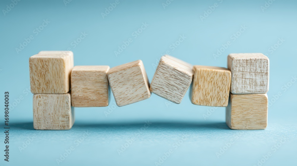 Poster stunning stack of wooden blocks forming a colorful bridge over a blue background inspiring creativit
