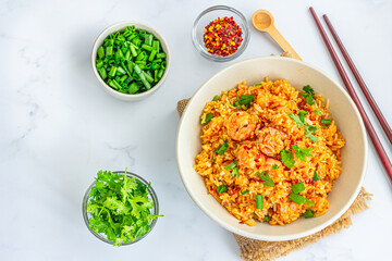 Delicious Asian chilli garlic fried rice on white background, cooked with fragrant rice, shrimp , soy sauce, and spicy red chilies.