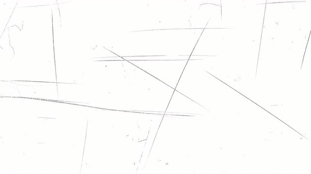 White surface with multiple dark thin scratches running in various directions