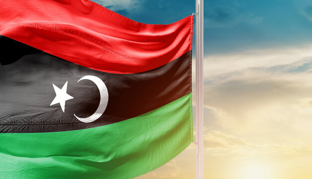 Libya national flag waving in an amazing sunlight. National flag waving on mast.