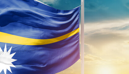 Nauru national flag waving in an amazing sunlight. National flag waving on mast.