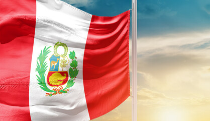 Peru national flag waving in an amazing sunlight. National flag waving on mast.