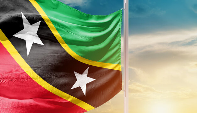 Saint Kitts and Nevis national flag waving in an amazing sunlight. National flag waving on mast.