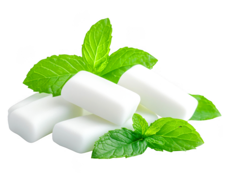 Pile of chewy white rectangles with vibrant green mint leaves 