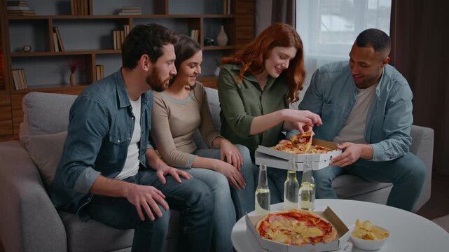 Multiracial four friends home party eating tasty pizza delivery service group of multiethnic diversity people men women talking laughing eat meal slices hanging out spending time together friendship