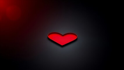 Red heart shape on a sleek black surface, radiating warmth and emotion with a minimalist aesthetic.