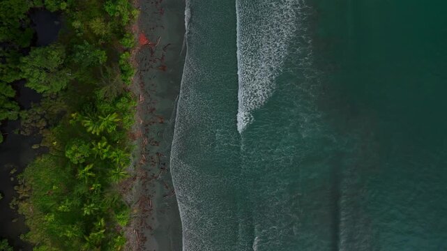 Untouched remote pristine tropical shore wave swell Cape Wom Public Beach Dogreto Bay Madang Wewak harbor view Papua New Guinea aerial drone Kavieng Vanimo Tufi island coastline sunny pristine static