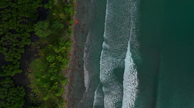 Remote untouched pristine tropical shore wave swell Cape Wom Public Beach Dogreto Bay Madang Wewak harbor view Papua New Guinea aerial drone Kavieng Vanimo Tufi island coastline sunny upwards motion