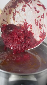 Cooking Process Preparation of a Colorful Red Dish in a Pot for Delicious Meals